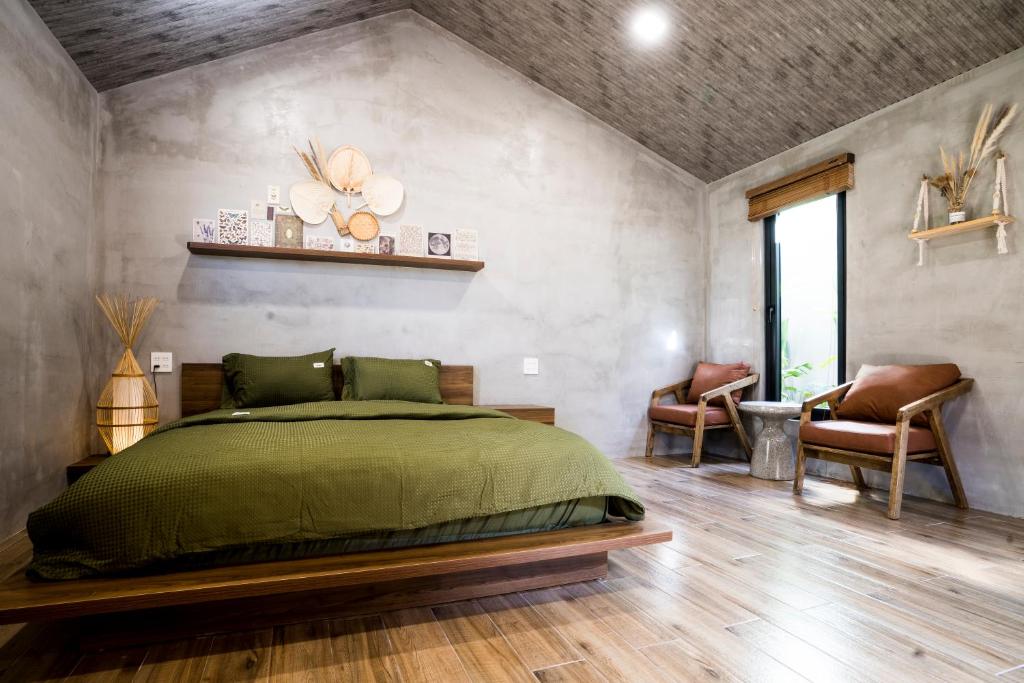 Giường trong phòng chung tại Eco House Villa