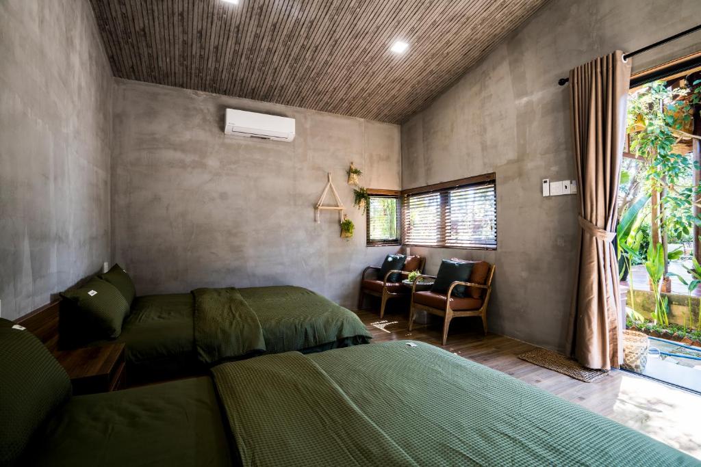 Giường trong phòng chung tại Eco House Villa