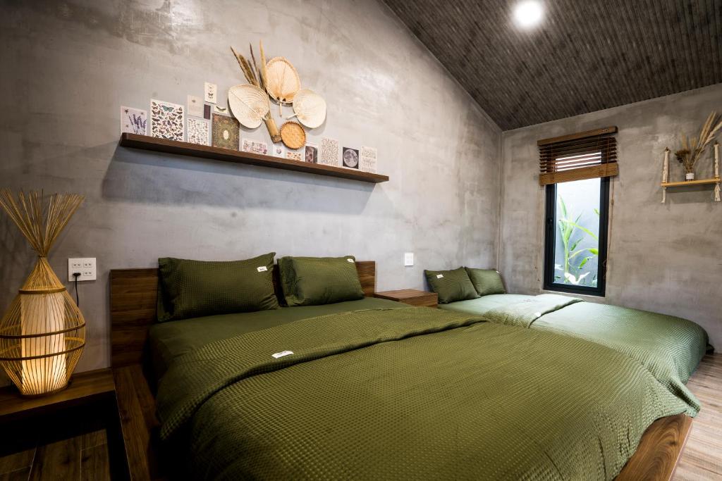 Giường trong phòng chung tại Eco House Villa