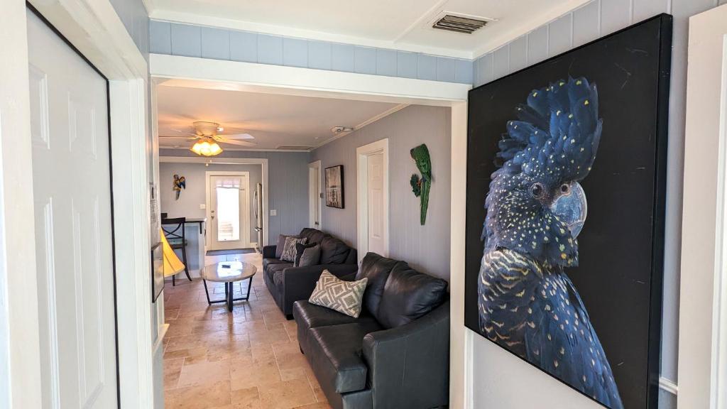 a living room with a large painting on the wall at 213 Ohio in Fort Myers Beach