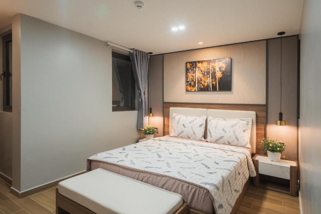 Giường trong phòng chung tại Thảo Nguyên House