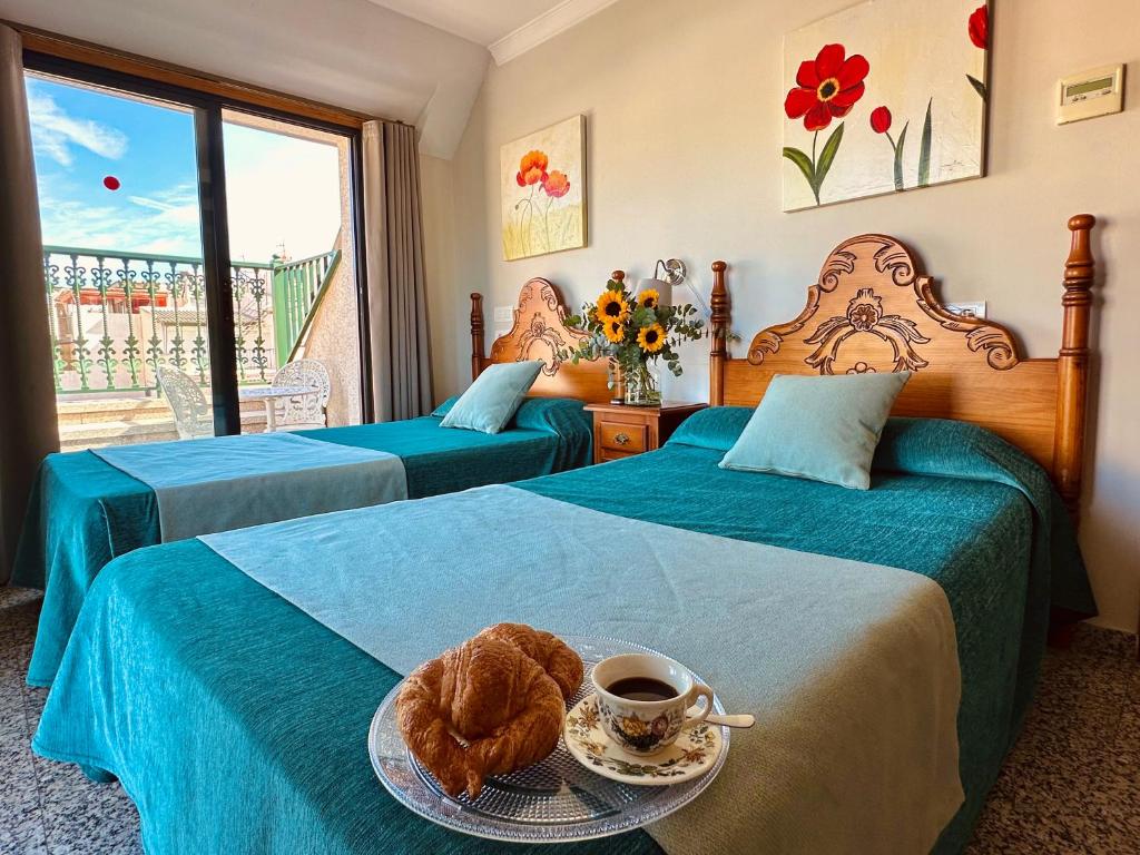 Postel nebo postele na pokoji v ubytování Hotel Reyesol