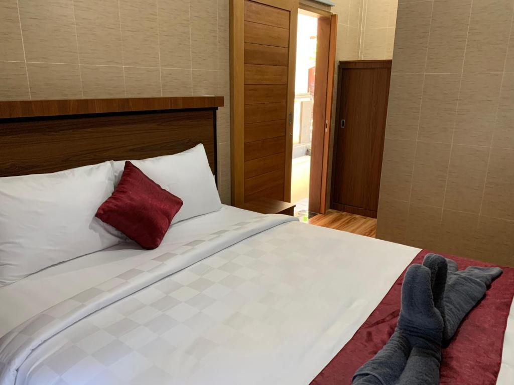 Postel nebo postele na pokoji v ubytování Tirtasuci House