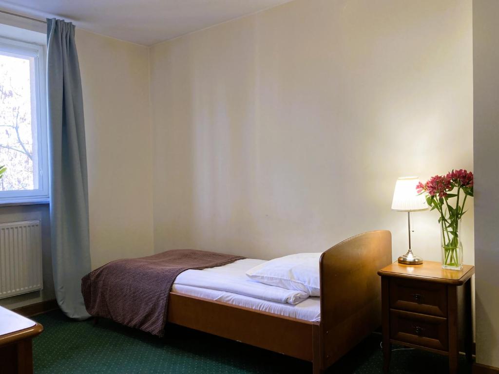 Posteľ alebo postele v izbe v ubytovaní Hotel Łazienkowski