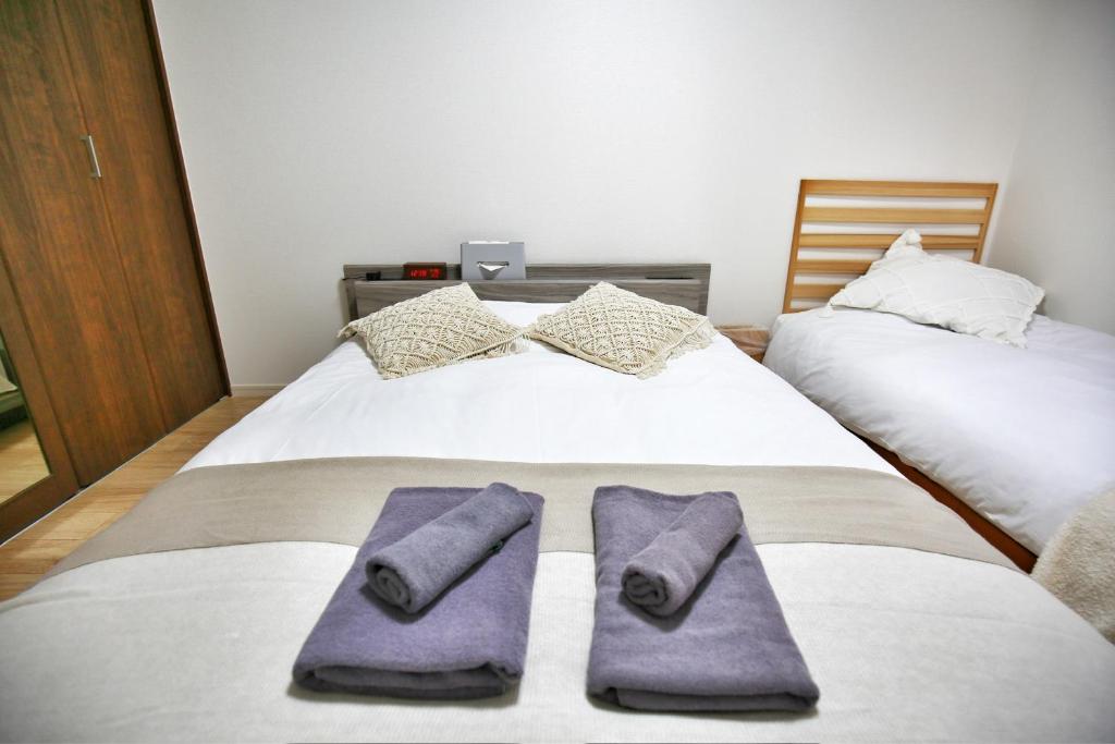 Postel nebo postele na pokoji v ubytování kameido k hotel