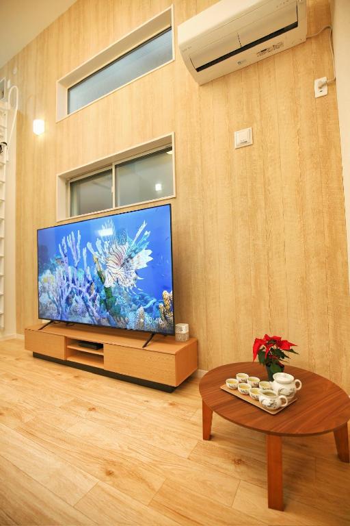 TV a/nebo společenská místnost v ubytování kameido k hotel