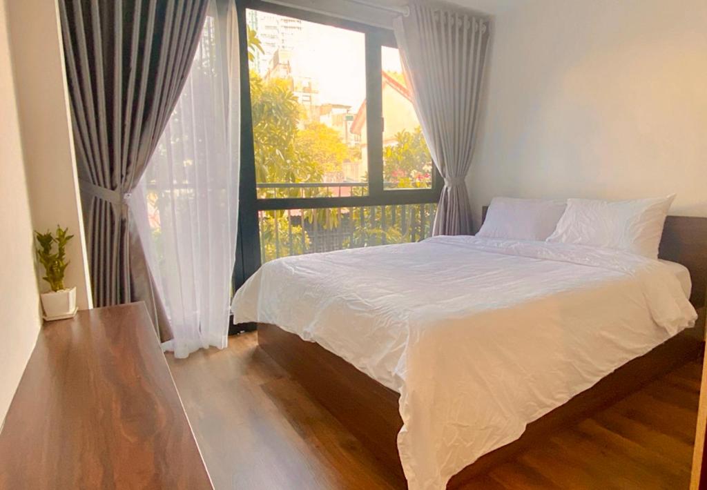 Postel nebo postele na pokoji v ubytování Wins Apartment
