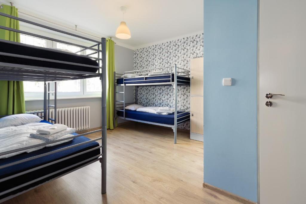 Postel nebo postele na pokoji v ubytování Patio Hostel Dorms