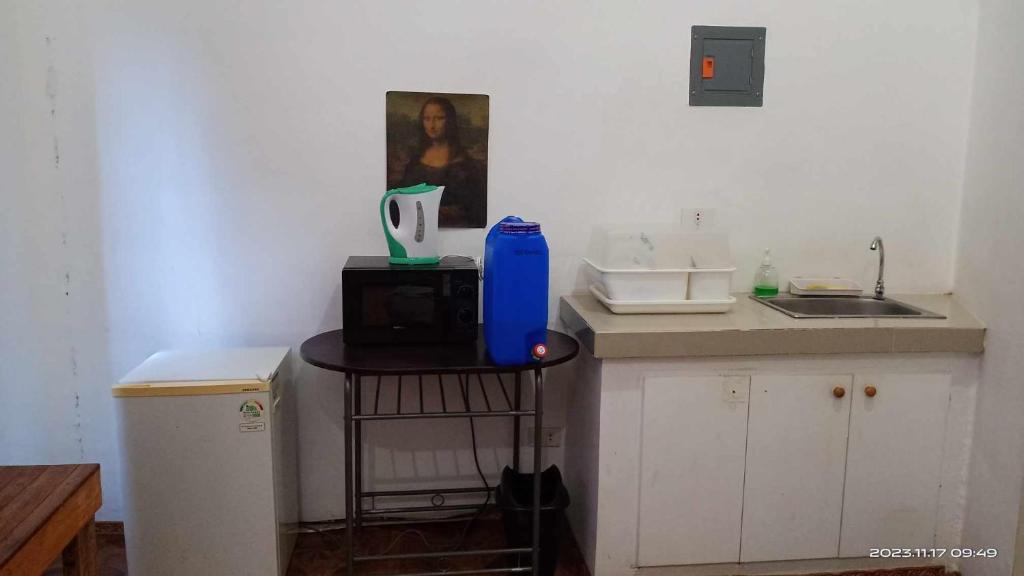 a kitchen with a counter with a blue bottle on it at 723 Moonlight Place 321-FREE WIFI in Antipolo