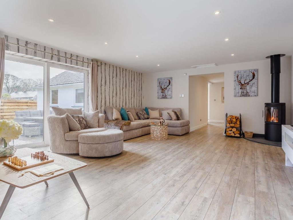 a living room with a couch and a fireplace at 6 Bed in Marazion 77228 in Saint Hilary