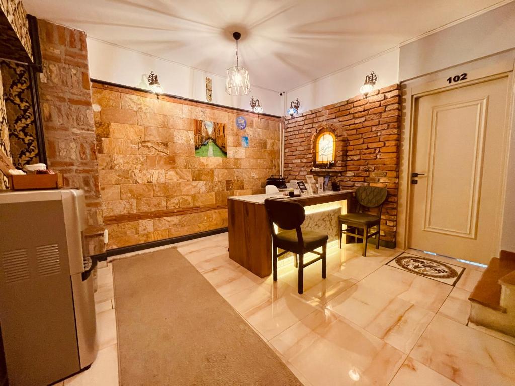 a kitchen with a table and chairs in a room at Lumina Boutique Hotel in Istanbul