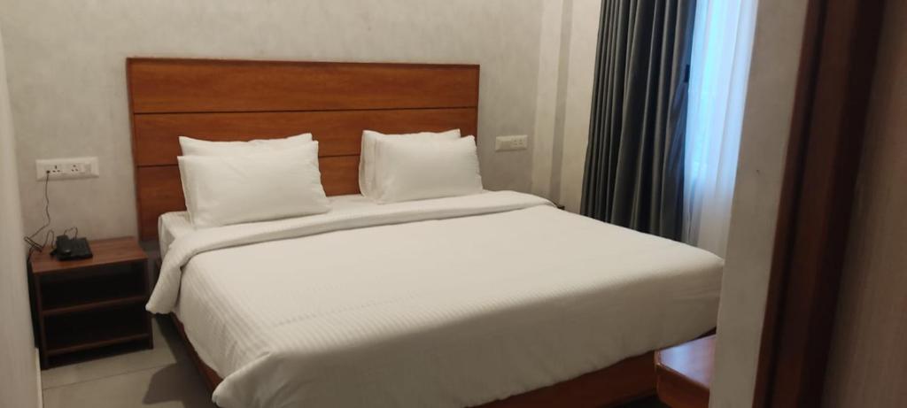 En eller flere senge i et værelse på CR RIVERA