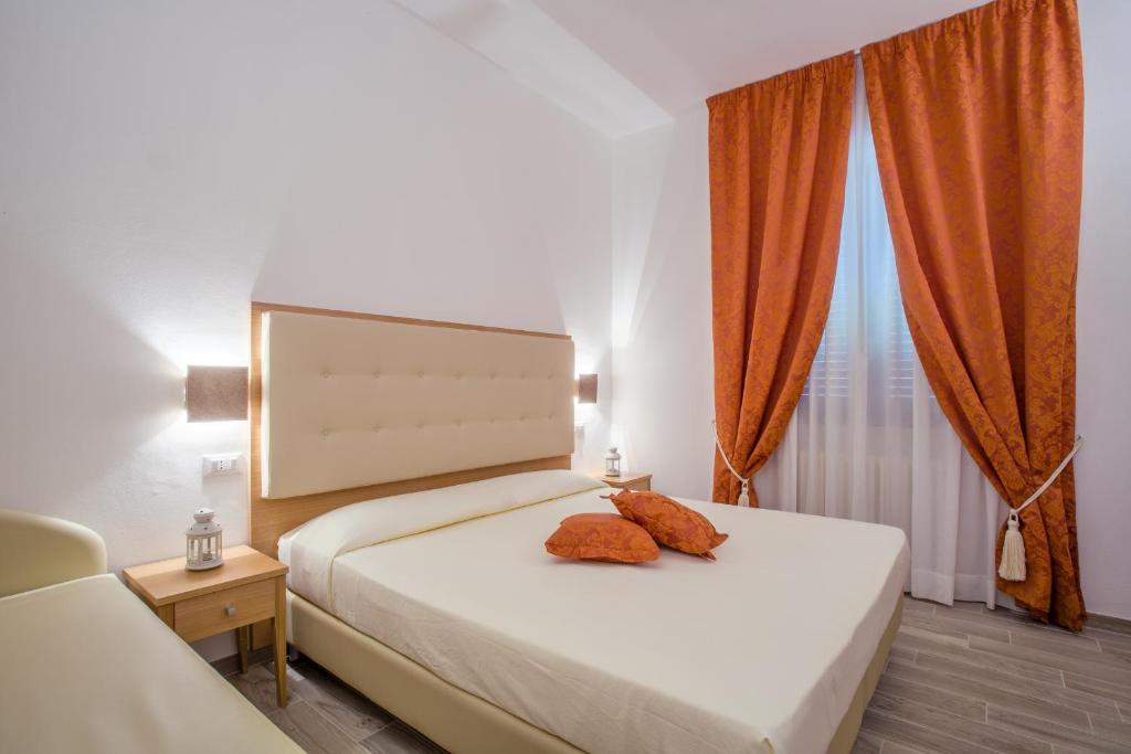 Postel nebo postele na pokoji v ubytování Hotel Il Buongustaio