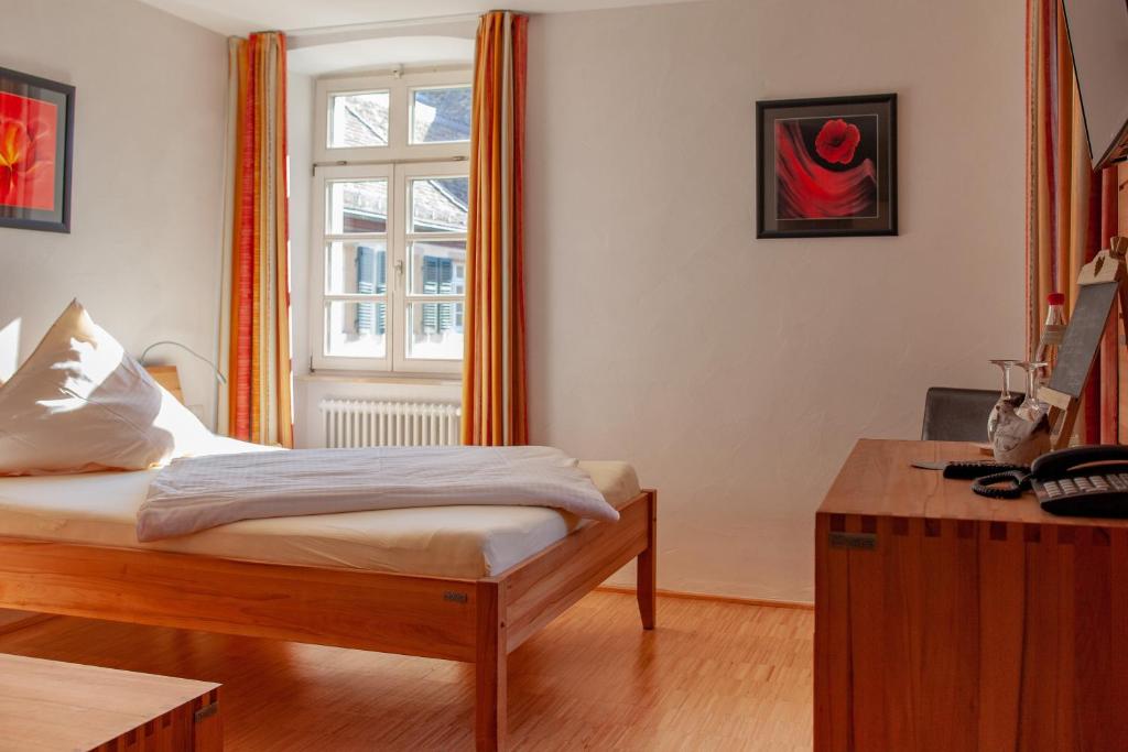 Postel nebo postele na pokoji v ubytování Hotel & Café Ritter von Böhl