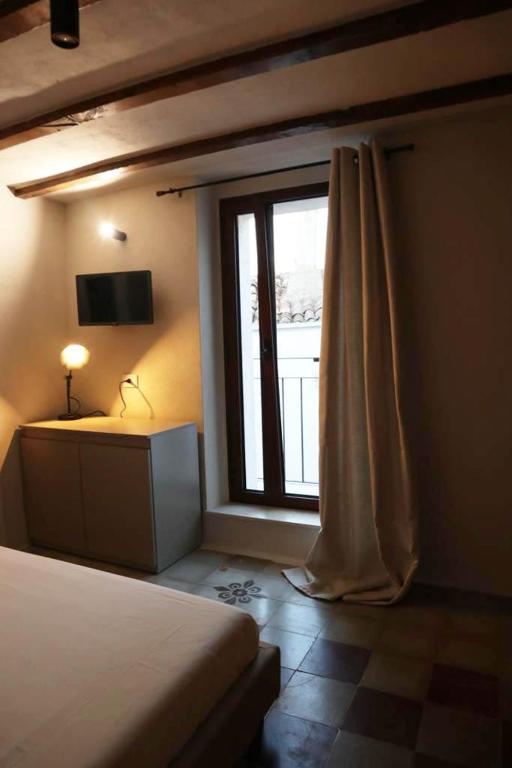 TV a/nebo společenská místnost v ubytování La Casetta b & b