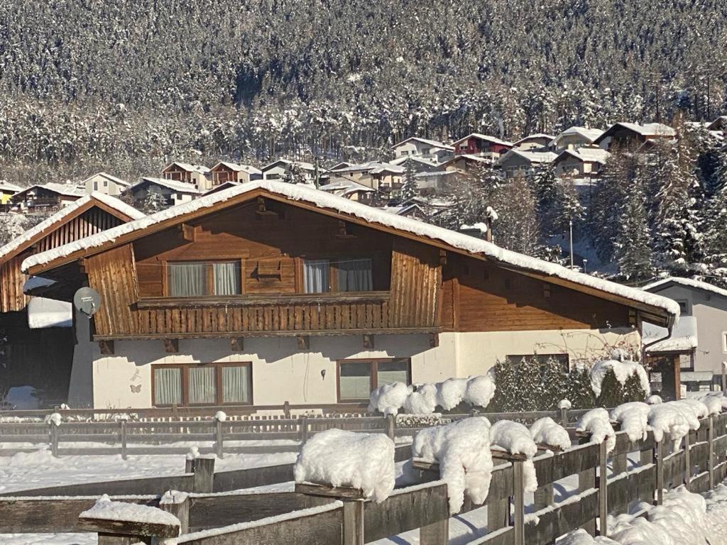 a herd of sheep standing in front of a house at Haus Reichlas in Längenfeld