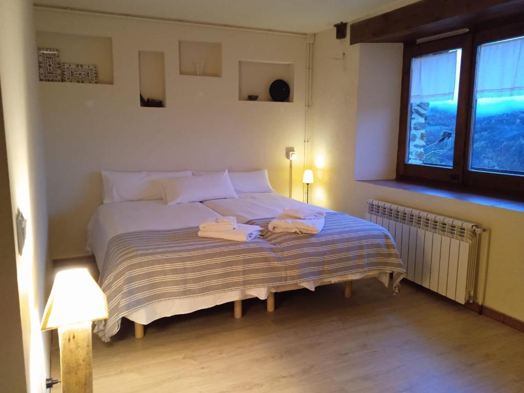 Postel nebo postele na pokoji v ubytování Casa Tapiolas Rectoría