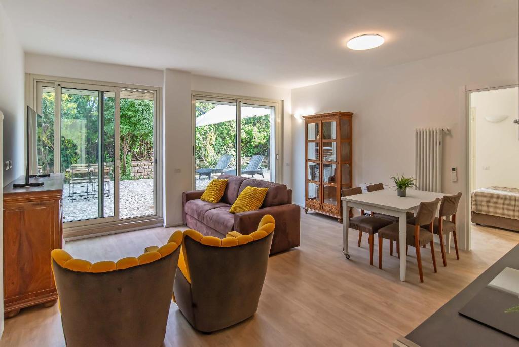 a living room with a couch and a table at Appartamenti Tre Fontane in Rome