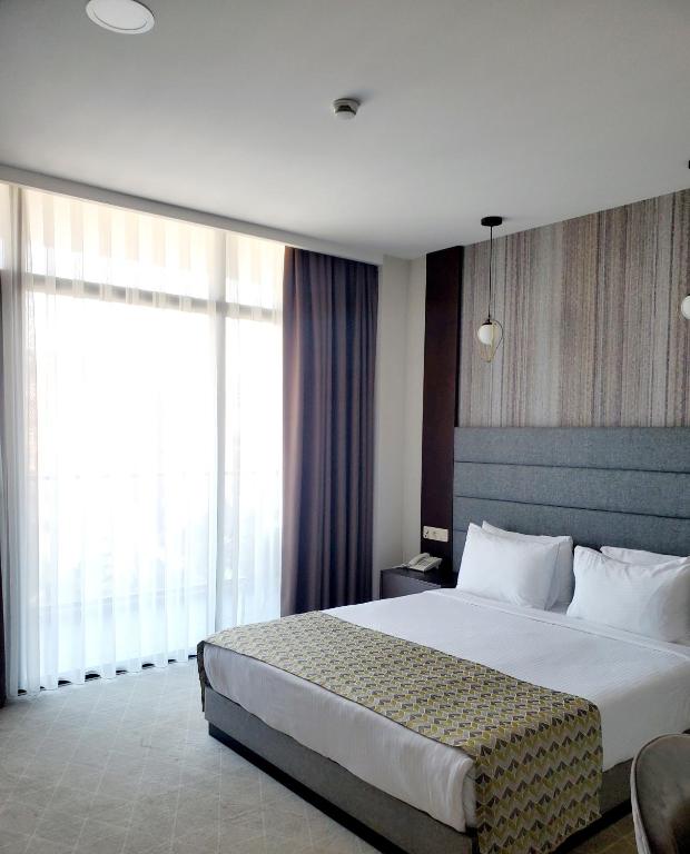 Postel nebo postele na pokoji v ubytování Hotel Salvador