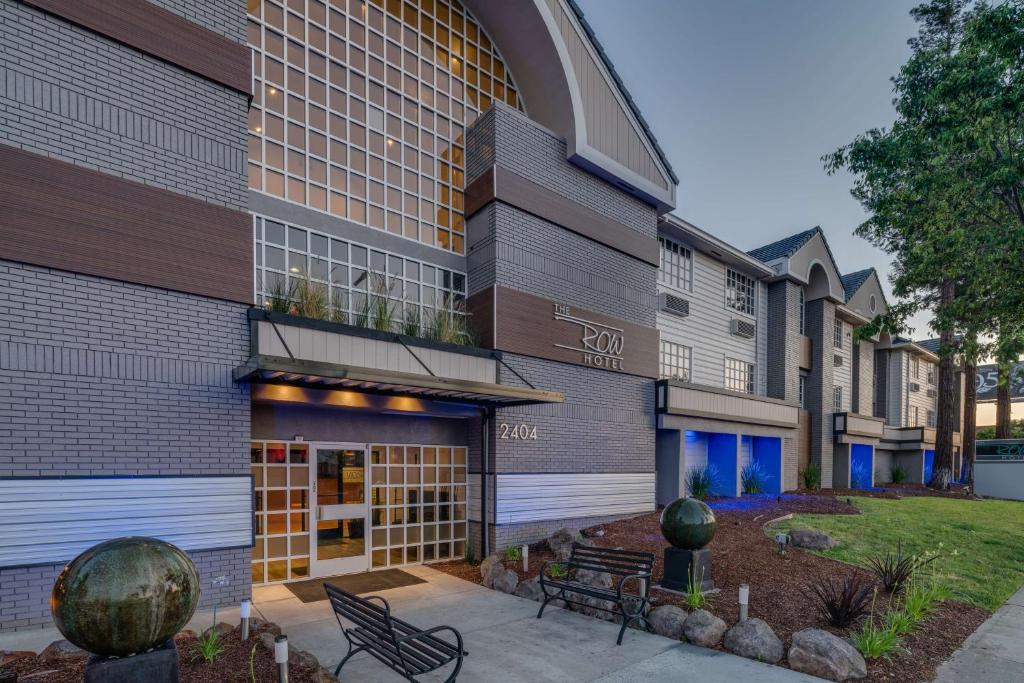 a building with a bench in front of it at The Row Hotel; BW Signature Collection in San Jose