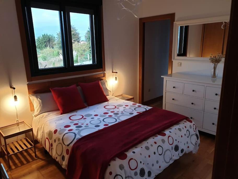 Ένα ή περισσότερα κρεβάτια σε δωμάτιο στο RESIDENCIAL A MAMOA