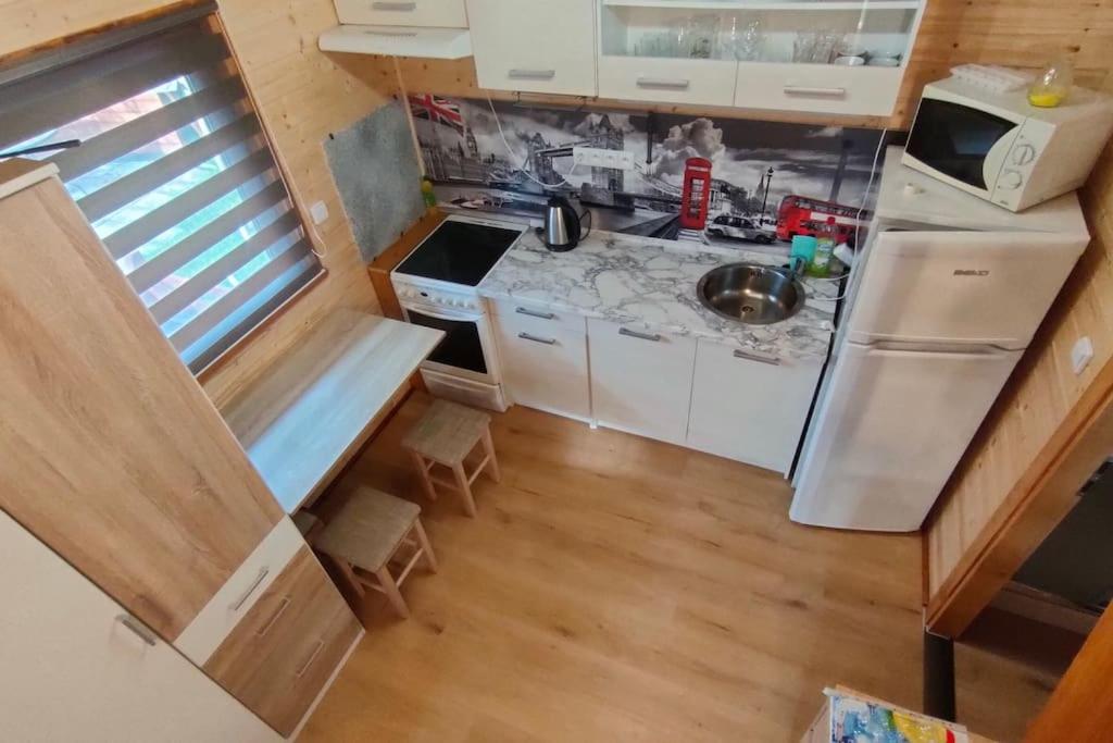 Kuchyň nebo kuchyňský kout v ubytování Tiny Treperka