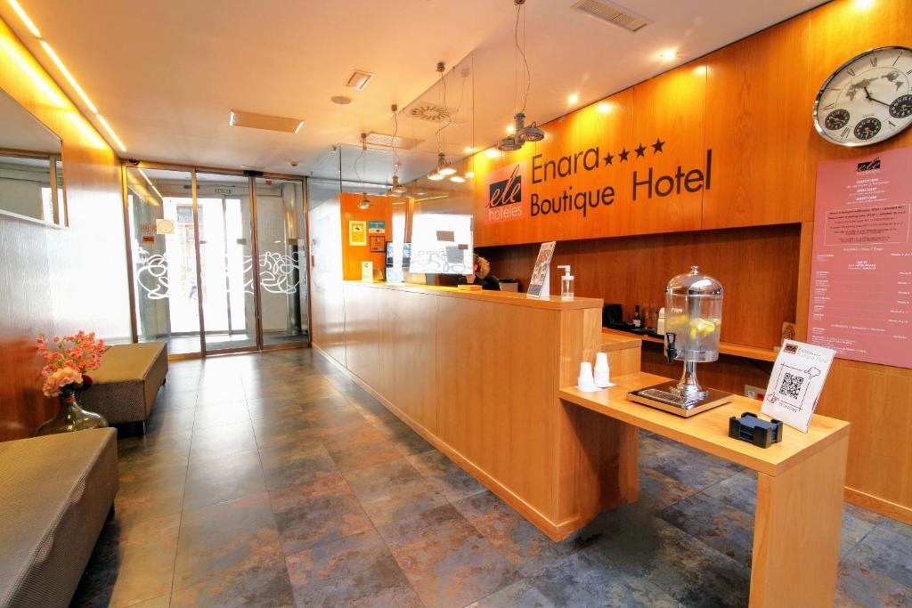 a lobby of a restaurant with a counter and a counter at ELE Enara Boutique Hotel in Valladolid