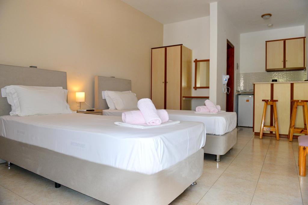 Postel nebo postele na pokoji v ubytování Hotel Marina