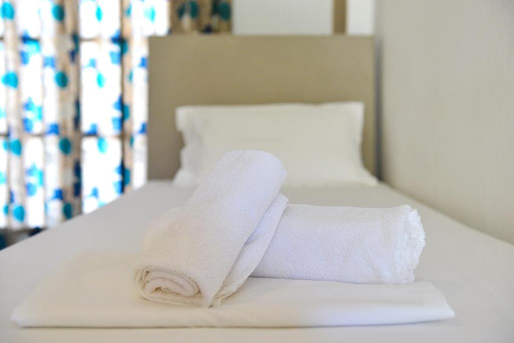 Postel nebo postele na pokoji v ubytování Hotel Marina