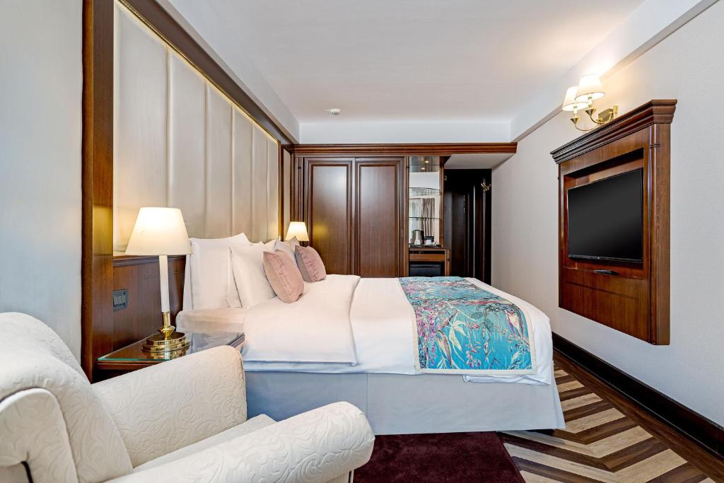 Postel nebo postele na pokoji v ubytování Hotel International