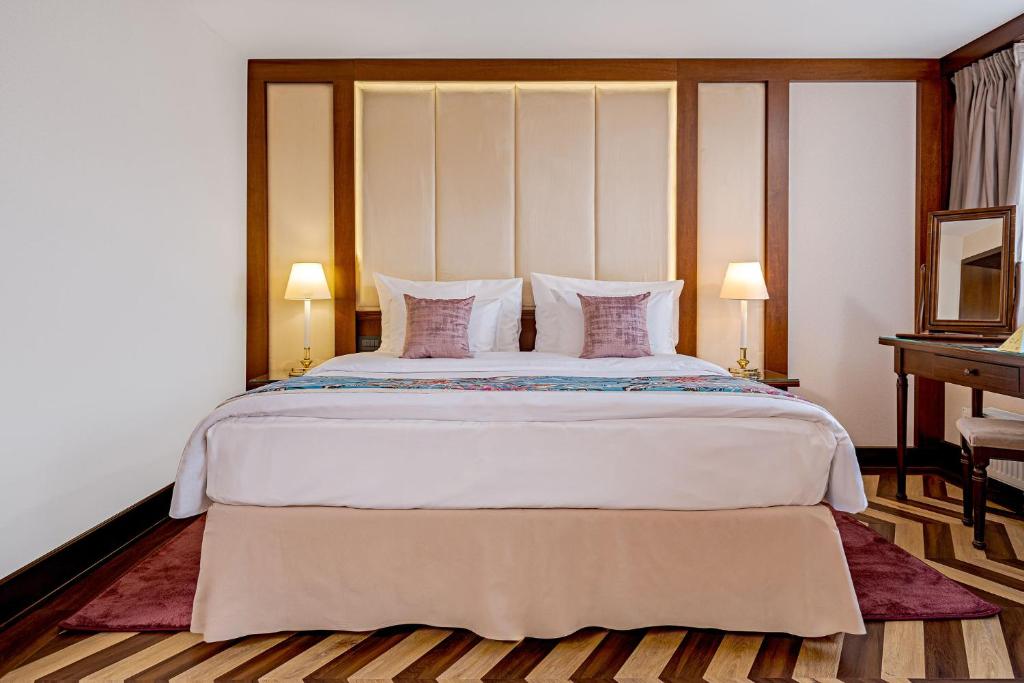 Postel nebo postele na pokoji v ubytování Hotel International