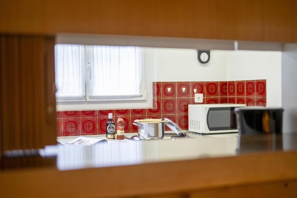 Kuchyň nebo kuchyňský kout v ubytování Brentschpark Wohnung 72