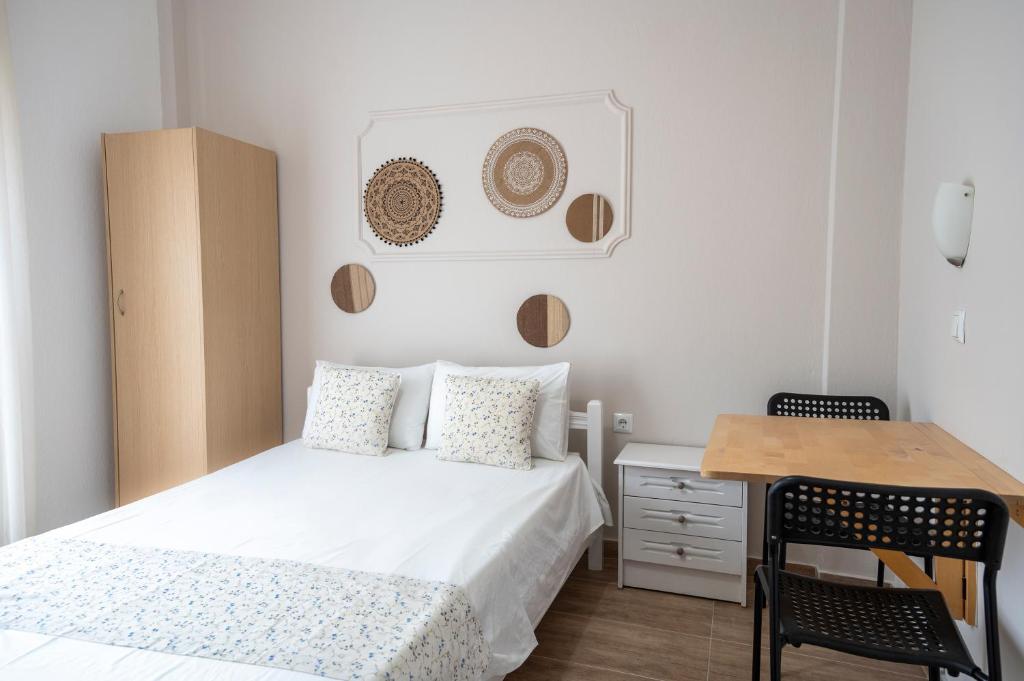 Łóżko lub łóżka w pokoju w obiekcie Stamatia Apartments