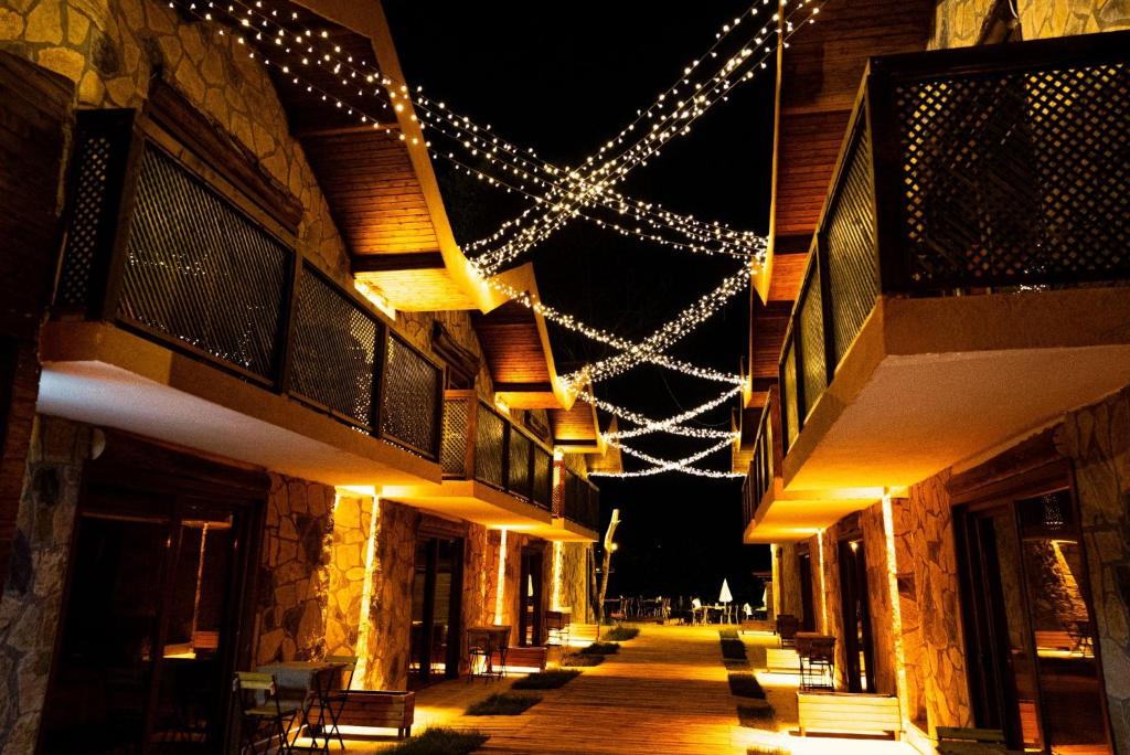a building with christmas lights on the side of it at Taş Mahall Luxury Hotel in Sile
