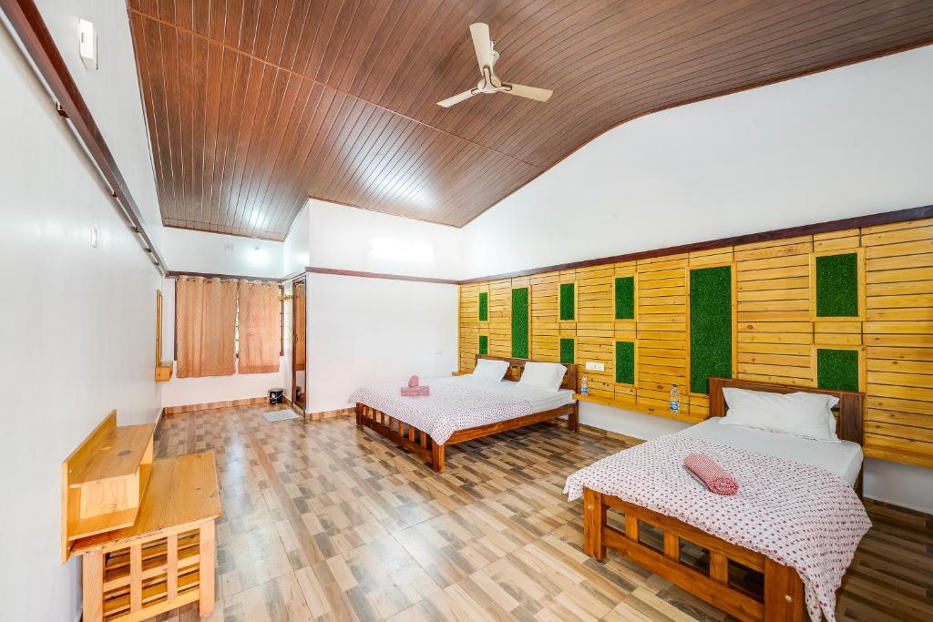 Voodi või voodid majutusasutuse Hatti Eden Coorg toas