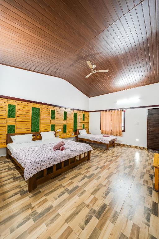 Voodi või voodid majutusasutuse Hatti Eden Coorg toas