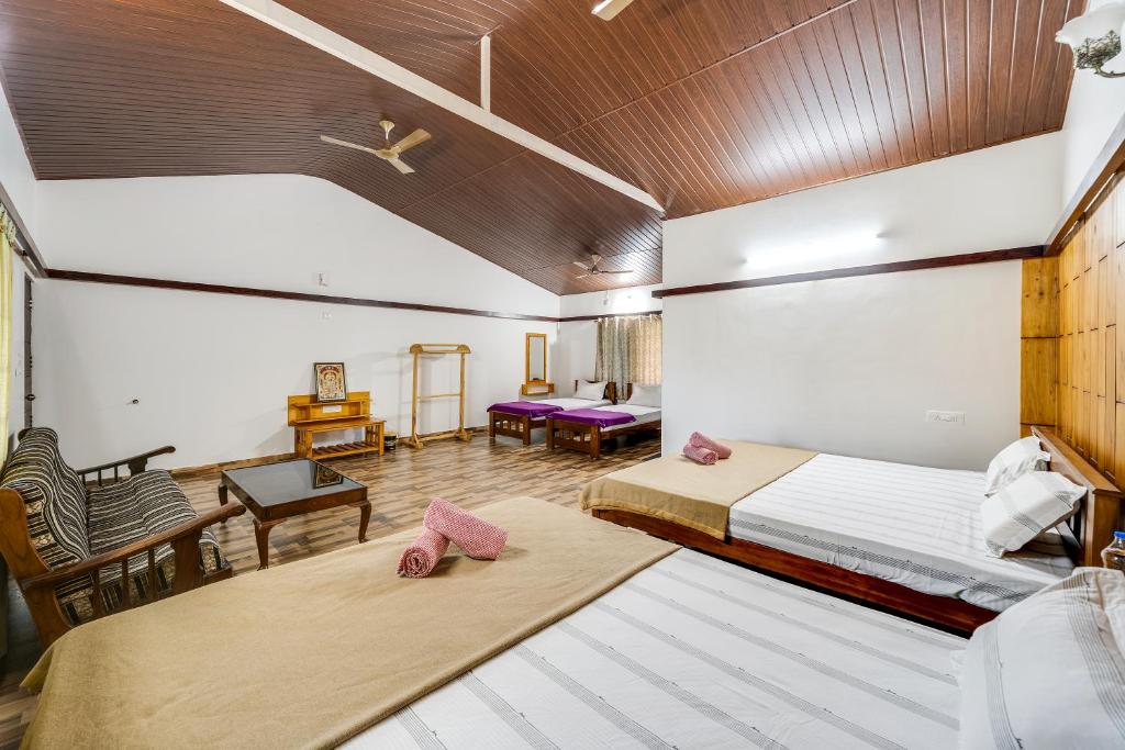Voodi või voodid majutusasutuse Hatti Eden Coorg toas