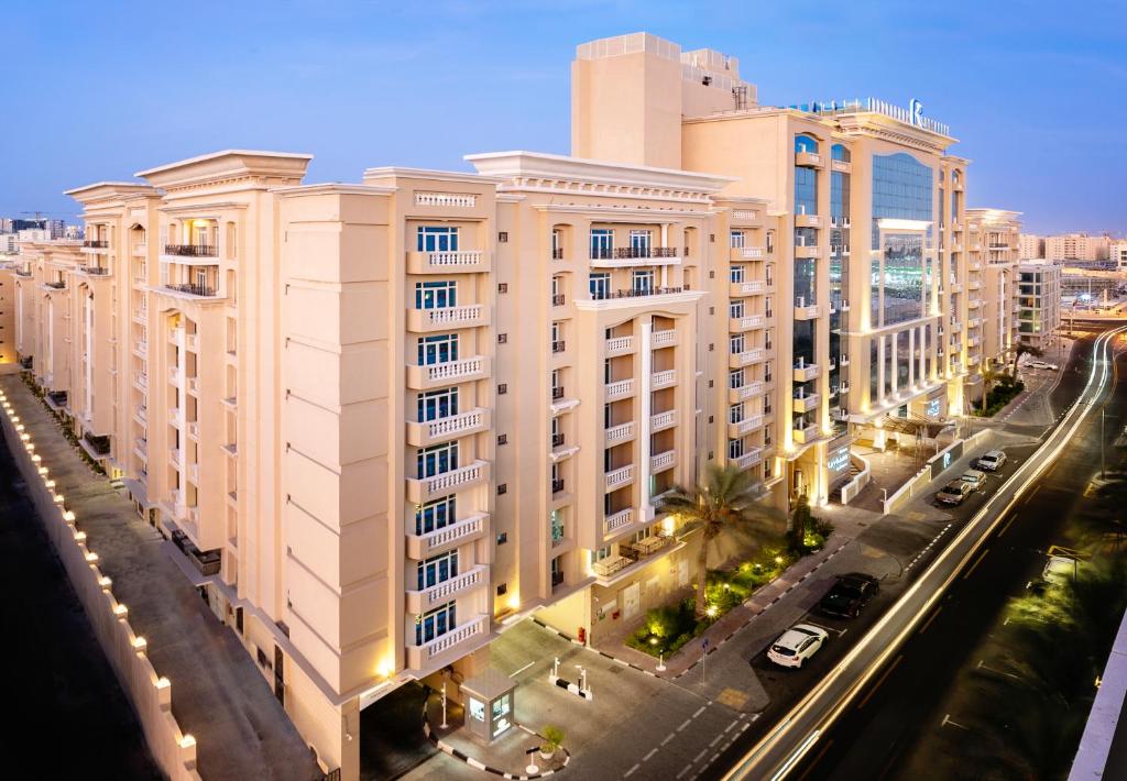 an overhead view of a building in a city at Riviera Rayhaan by Rotana Doha in Doha