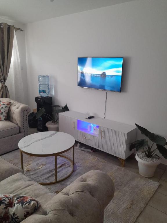 TV a/nebo společenská místnost v ubytování REMA AIRBNB'S