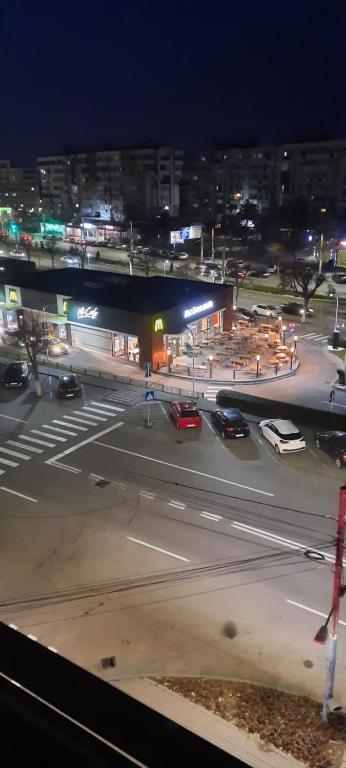 a view of a city street at night at Apartament in Craiova