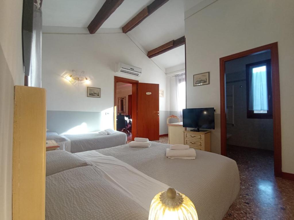 Postel nebo postele na pokoji v ubytování Locanda Ca' Formosa