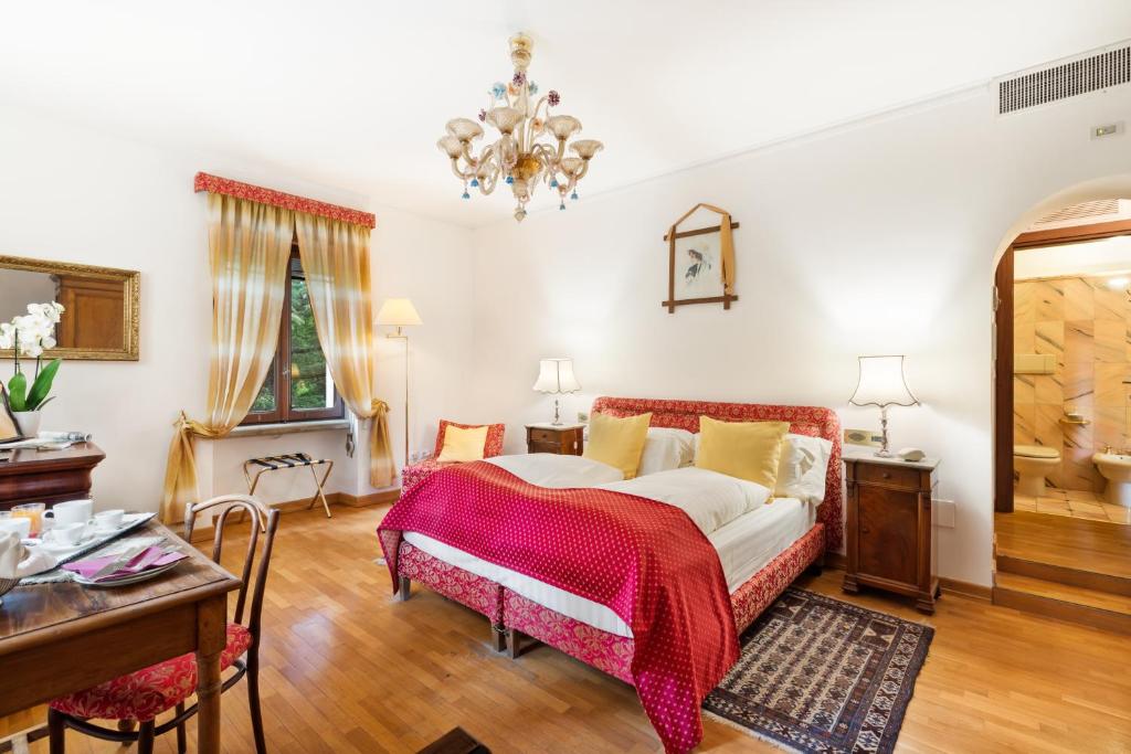 Postel nebo postele na pokoji v ubytování Villa Pambuffetti