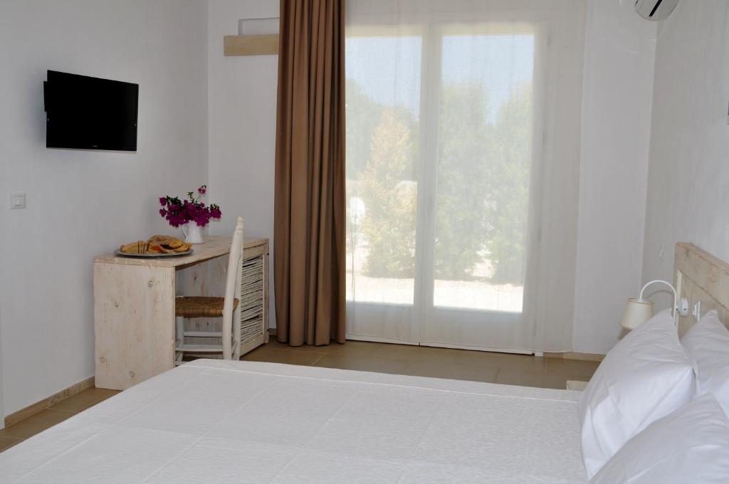 Postel nebo postele na pokoji v ubytování Agriturismo La Turrita