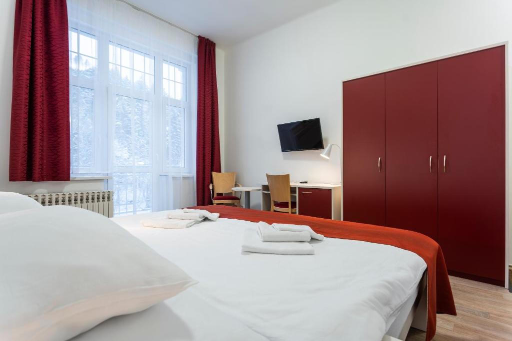 Postel nebo postele na pokoji v ubytování Apartmánový komplex Dagmar