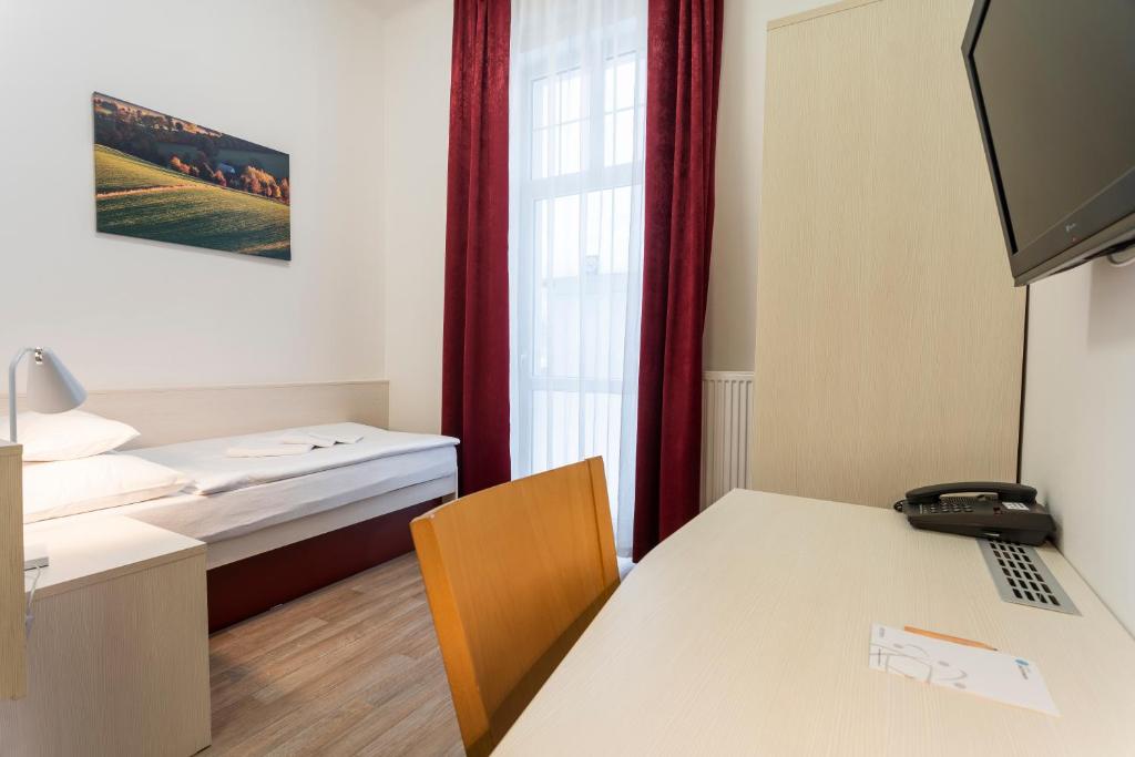 TV a/nebo společenská místnost v ubytování Apartmánový komplex Dagmar