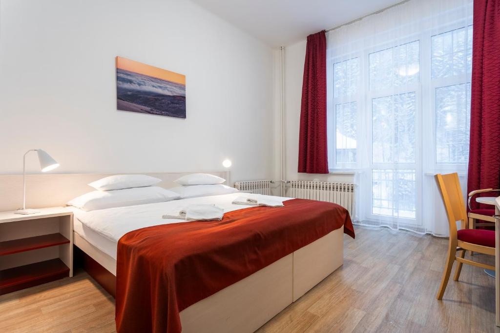 Postel nebo postele na pokoji v ubytování Apartmánový komplex Dagmar