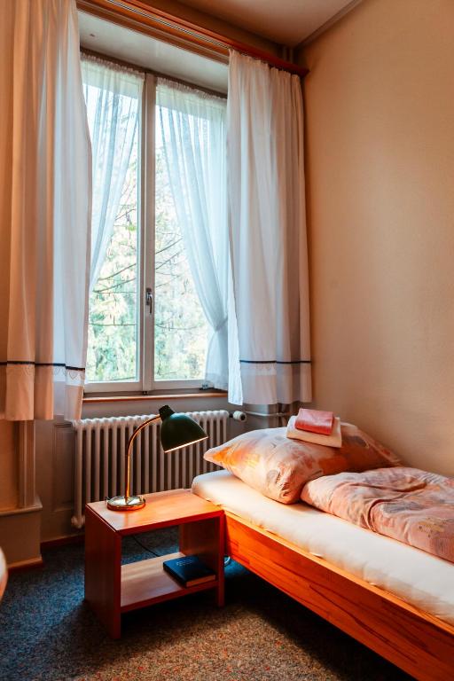 Postel nebo postele na pokoji v ubytování Chrischona Berg
