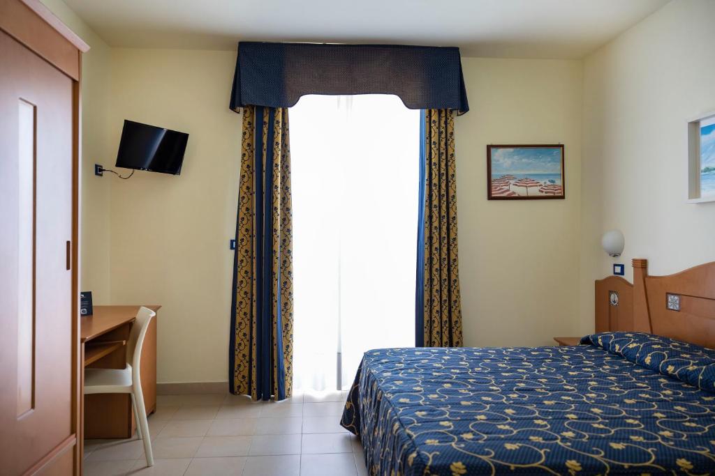 Postel nebo postele na pokoji v ubytování Blu Salento Village