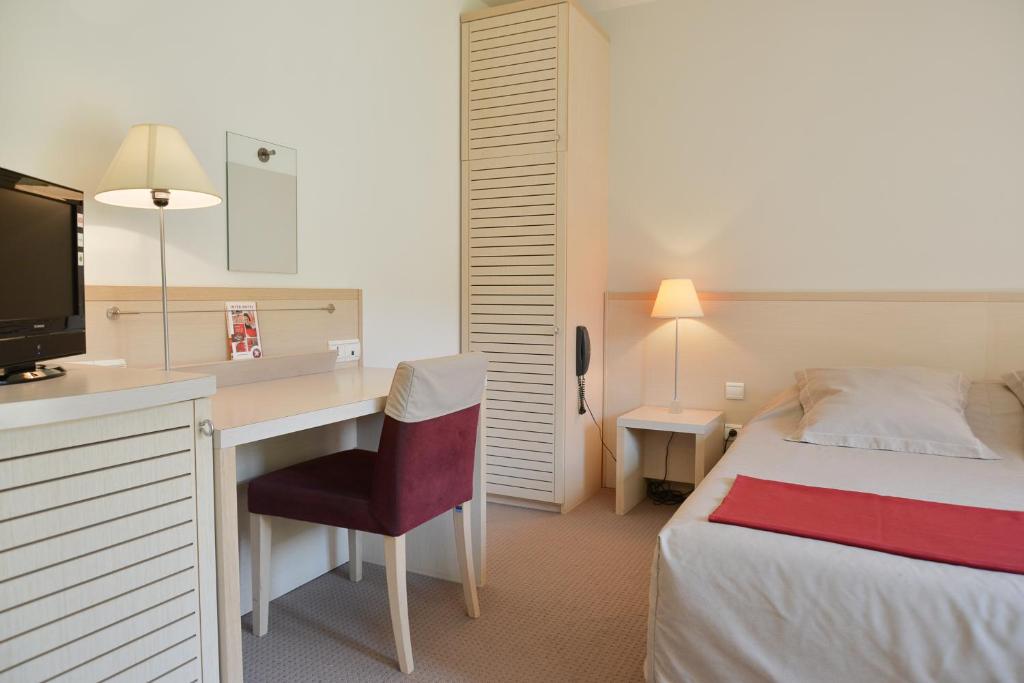 Postel nebo postele na pokoji v ubytování Hotel Restaurant Rolland