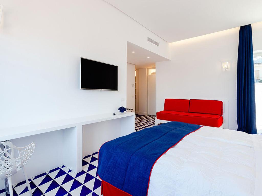 Postel nebo postele na pokoji v ubytování Maison Blu - Intimate GuestHouse